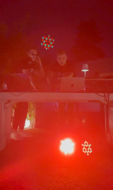 ROOM:SRVC DJ duo live performance with red lights