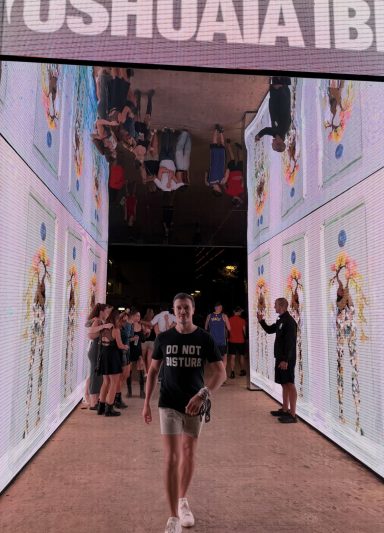 ROOM:SRVC DJ walking through LED light tunnel before live show